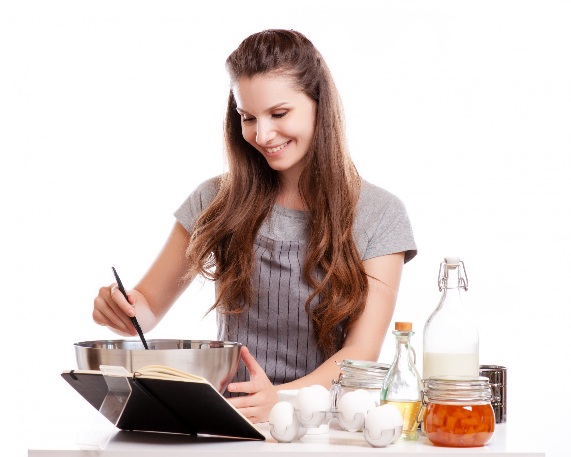 Student with tablet following an online cooking lesson