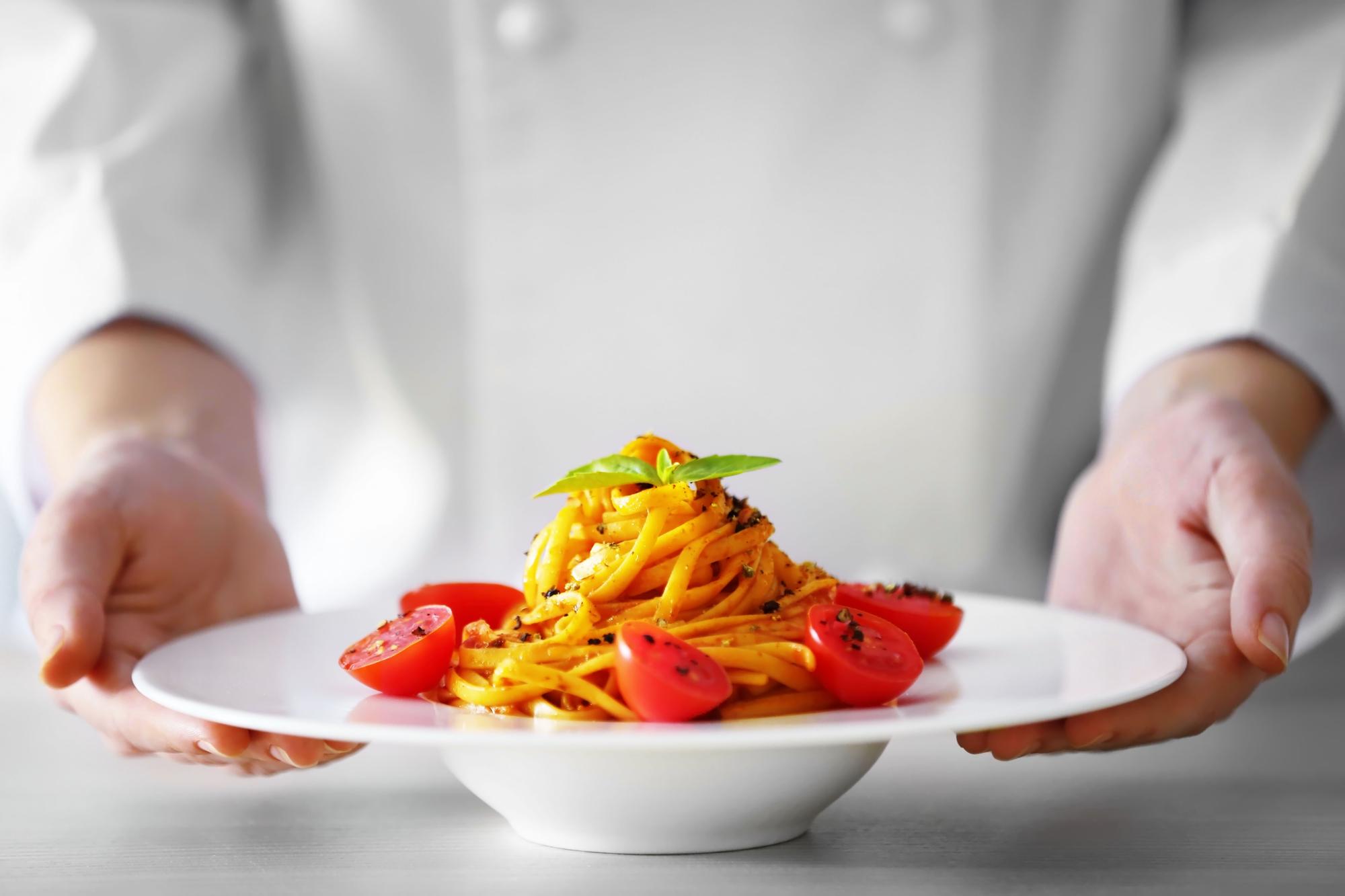 Chef preparing a quick pasta dish in a bright kitchen